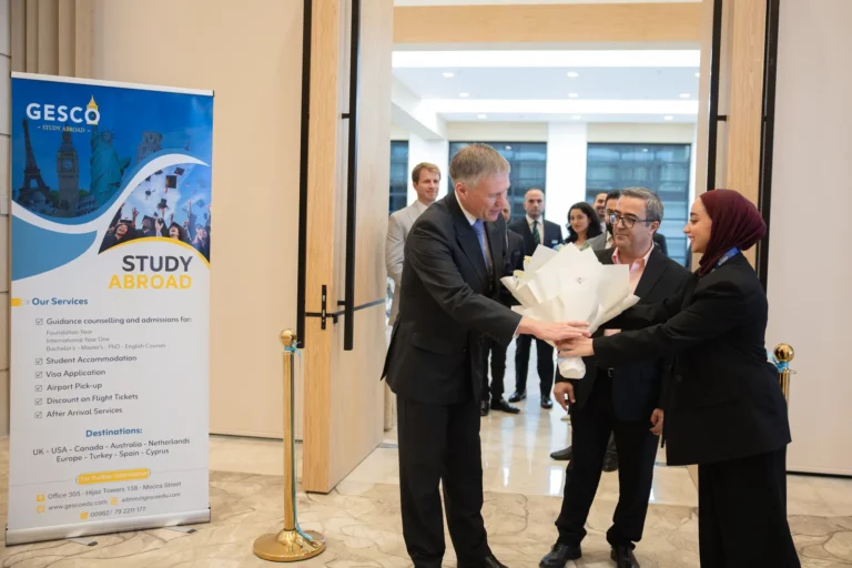 A guest of honour is welcomed with flowers at the entrance to the 28th GESCO Education Fair in Amman