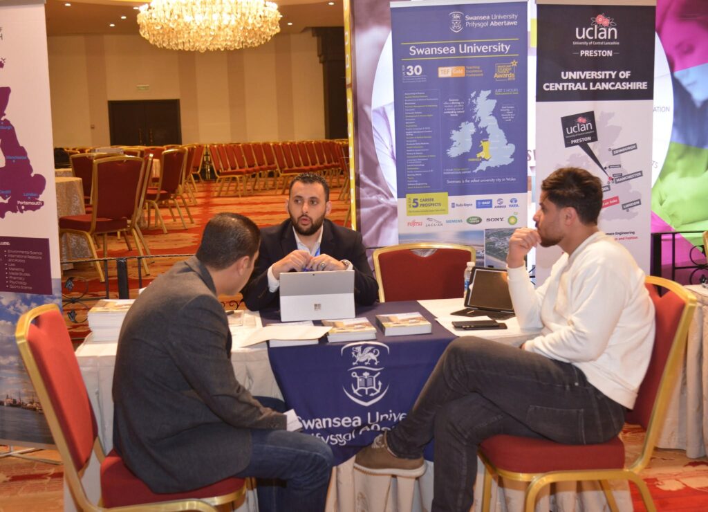University representatives meeting students at their stand