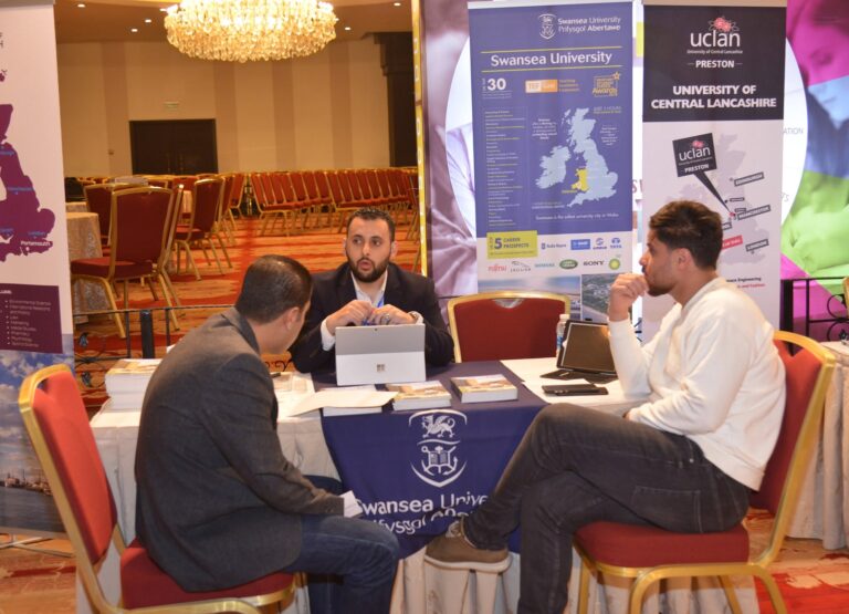 University representatives meeting students at their stand
